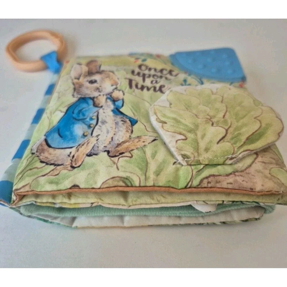 Peter Rabbit Soft Squeaky Baby Book with Silicone Teether & On the Go Clip